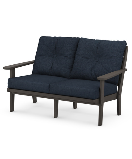 The Lakeside Deep Seating Lovseat seats up to two and achieves laid-back comfort and style with plush pillow-back cushions and a timeless back design. 