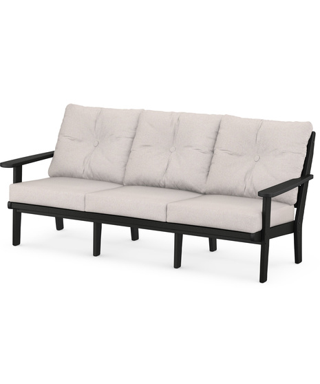 The Lakeside Deep Seating Sofa seats up to three and achieves laid-back comfort and style with plush pillow-back cushions and timeless back design.