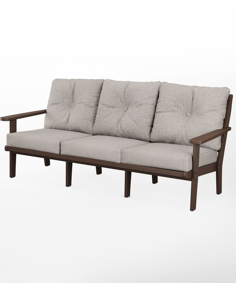 The Lakeside Deep Seating Sofa seats up to three and achieves laid-back comfort and style with plush pillow-back cushions and timeless back design.