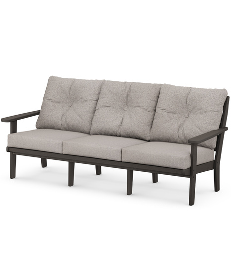 The Lakeside Deep Seating Sofa seats up to three and achieves laid-back comfort and style with plush pillow-back cushions and timeless back design.