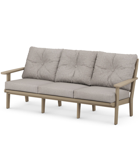 The Lakeside Deep Seating Sofa seats up to three and achieves laid-back comfort and style with plush pillow-back cushions and timeless back design.