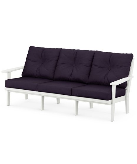 The Lakeside Deep Seating Sofa seats up to three and achieves laid-back comfort and style with plush pillow-back cushions and timeless back design.