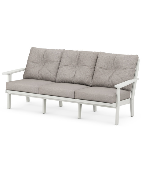 The Lakeside Deep Seating Sofa seats up to three and achieves laid-back comfort and style with plush pillow-back cushions and timeless back design.