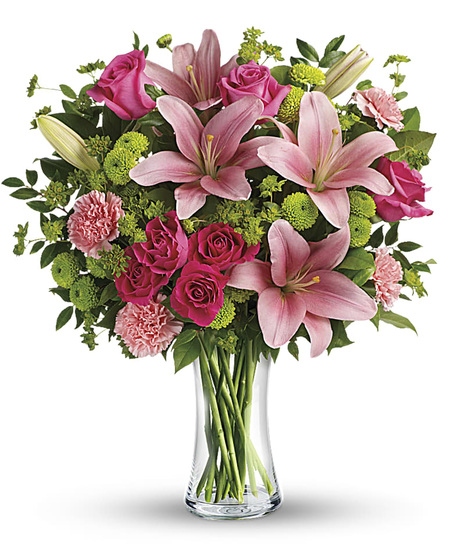 This sweet arrangement features green hydrangea, hot pink roses, pink spray roses, peach asiatic lilies, pink alstroemeria, green carnations, pink miniature carnations