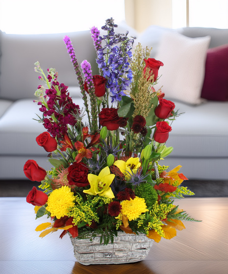 Montana Meadow Bouquet with protea, lilies, roses, delphinium & more. A large, vibrant garden-style bouquet full of color and texture.”