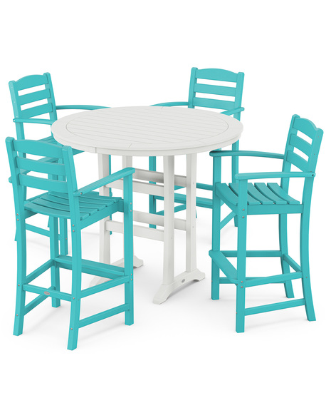 This bar-height table seats four and features a table top with rounded edges and space for plenty of leg room underneath paired with traditional La Casa Café Bar Arm Chairs