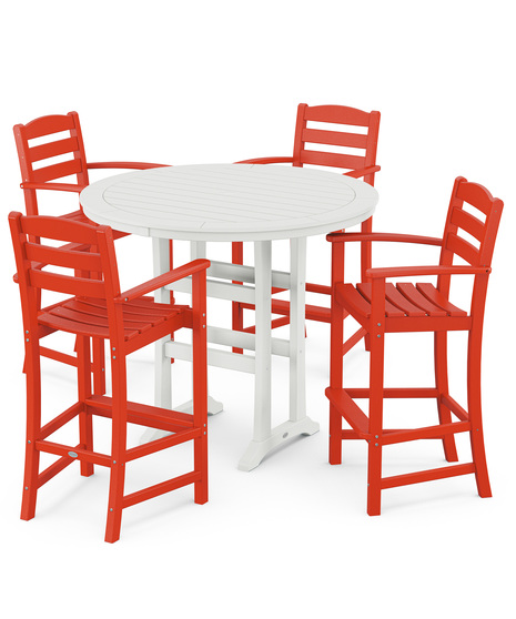 This bar-height table seats four and features a table top with rounded edges and space for plenty of leg room underneath paired with traditional La Casa Café Bar Arm Chairs