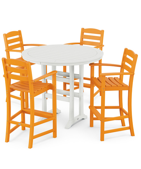 This bar-height table seats four and features a table top with rounded edges and space for plenty of leg room underneath paired with traditional La Casa Café Bar Arm Chairs