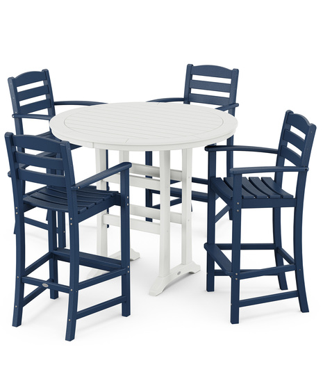 This bar-height table seats four and features a table top with rounded edges and space for plenty of leg room underneath paired with traditional La Casa Café Bar Arm Chairs