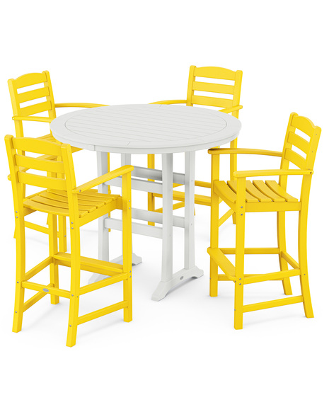 This bar-height table seats four and features a table top with rounded edges and space for plenty of leg room underneath paired with traditional La Casa Café Bar Arm Chairs