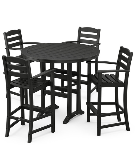 This bar-height table seats four and features a table top with rounded edges and space for plenty of leg room underneath paired with traditional La Casa Café Bar Arm Chairs