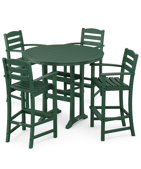 This bar-height table seats four and features a table top with rounded edges and space for plenty of leg room underneath paired with traditional La Casa Café Bar Arm Chairs