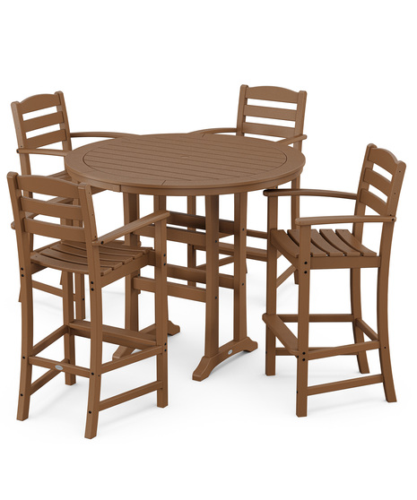 This bar-height table seats four and features a table top with rounded edges and space for plenty of leg room underneath paired with traditional La Casa Café Bar Arm Chairs