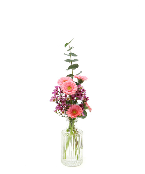 A petite bouquet featuring micro gerbera daisies with delicate accents in a bud vase. 