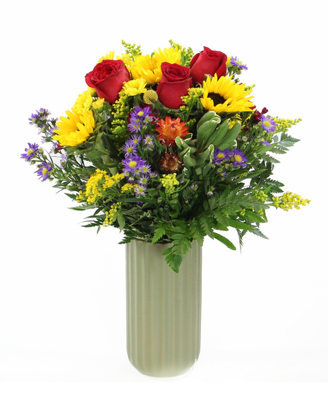 Bursting with spirit, this green vase overflows with the happy presence of sunflowers and more - a perfect way to infuse any setting with warmth and positivity.