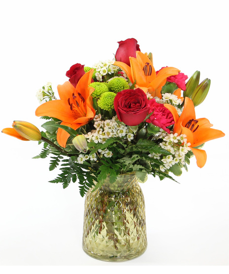 Say hello to happiness with this bouquet featuring carnations, Asiatic lilies and more designed  in a colored glass vase ready to bring a burst of joy to someone special.