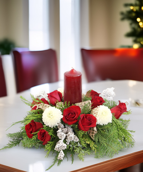 Holiday Grandeur Centerpiece with red roses, white disbuds, evergreens, gold ribbon & pomegranate candle. A luxury holiday design.