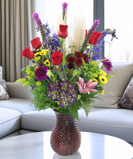 The Monet bouquet with hydrangea, lilies, delphinium & pampas grass in glass vases. Luxury autumn floral gift