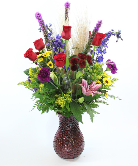 The Monet bouquet with hydrangea, lilies, delphinium & pampas grass in glass vases. Luxury autumn floral gift