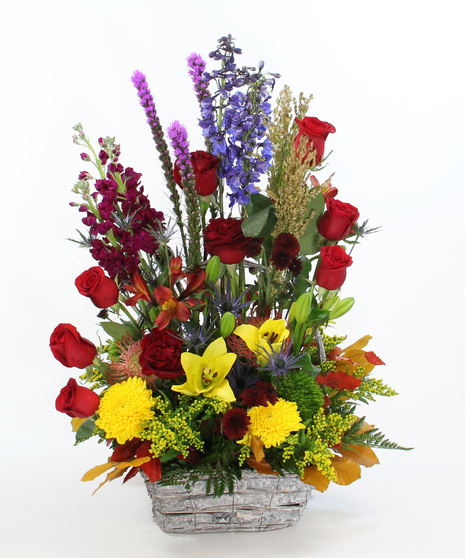 Montana Meadow Bouquet with protea, lilies, roses, delphinium & more. A large, vibrant garden-style bouquet full of color and texture.”