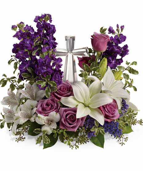 This garden of roses, lilies and alstroemeria surrounds a gleaming Crystal Cross. It's a radiant, reverent expression of faith that will be appreciated for years to come.