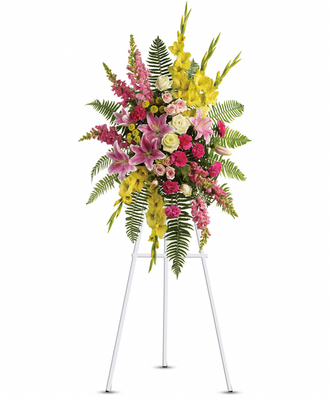 The bright yellows and peaceful pinks in this standing spray create an impressively balanced display.