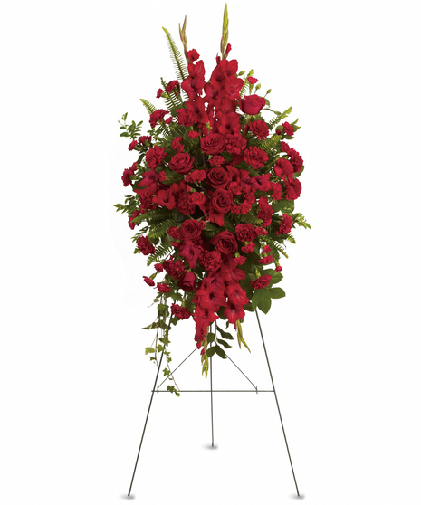 This rich, radiant spray of red roses, gladioli and other popular red flowers during a time of loss conveys a message of reassurance and hope in a difficult time.