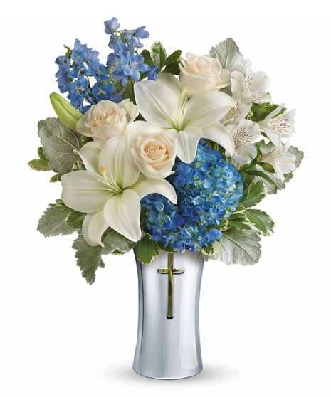 As hopeful as a bright blue sky, this beautiful arrangement of lush blue hydrangea and fragrant white lilies is a heartfelt symbol of peace and beauty.