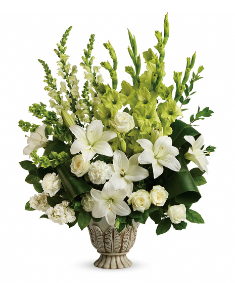 Peaceful and majestic in a large antiqued pot, this wondrous white arrangement is a touching tribute to a bright life, and your unending support. 