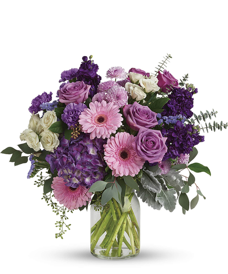 This harmonic mix of deep purple hydrangea with light lavender roses and sweet pink gerberas is a dreamy delight on any occasion.