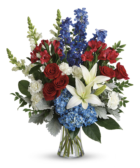 Perfectly patriotic with its red, white and blue blooms, this bold bouquet of hydrangea, lilies and roses is a versatile tribute on any occasion.