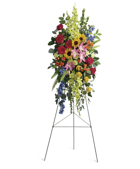 Bursting with joy, this radiant spray of rainbow blooms is an exuberant tribute to never-ending love.