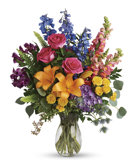 Color any occasion beautiful with this lovely bouquet of hydrangea, roses and lilies in all the colors of the rainbow.