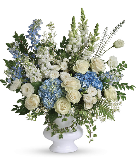 A treasured tribute to your beloved, this gorgeously grand bouquet of soft blue hydrangea and pure white roses is reminiscent of life and love. 